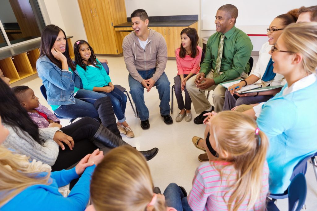 Group of parents receiving counseling from doctor