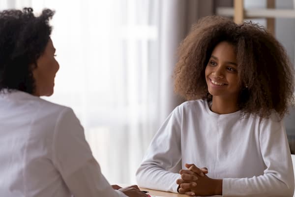 Teenager talking to doctor